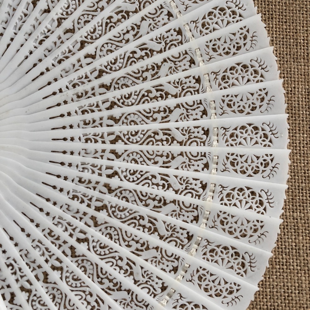 Vintage Ivory Hand Fan with Intricate Details. Made in Hong Kong.